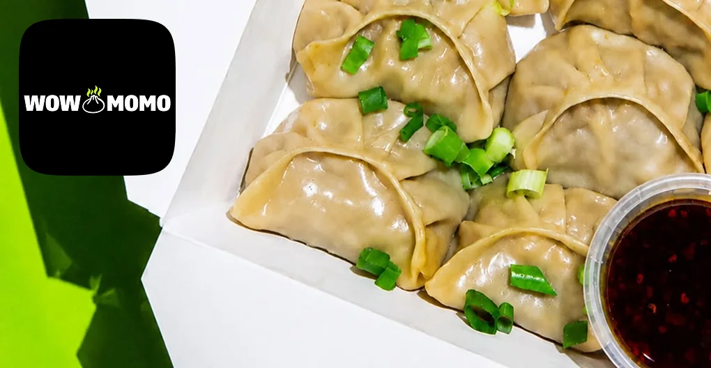 Wow Momo steamed dumplings with spring onion and dipping sauce
